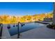 Gorgeous pool with a view of desert mountains and decorative white spheres at 13412 N 14Th Pl, Phoenix, AZ 85022
