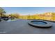 The backyard contains a pool, spa and views of the golf course and the mountain terrain surrounding the property at 13412 N 14Th Pl, Phoenix, AZ 85022