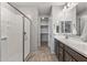 Clean and bright bathroom with a walk-in shower and double vanity at 13648 W Desert Glen Dr, Sun City West, AZ 85375