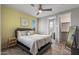 Bedroom with a queen-size bed and access to a private bathroom at 13648 W Desert Glen Dr, Sun City West, AZ 85375