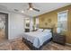 Comfortable bedroom with ensuite bathroom and lots of natural light at 13648 W Desert Glen Dr, Sun City West, AZ 85375