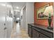 Hallway with dark brown cabinets and view of the living room at 13648 W Desert Glen Dr, Sun City West, AZ 85375