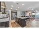 Open concept kitchen with island and stainless steel appliances at 13648 W Desert Glen Dr, Sun City West, AZ 85375