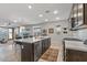 Open concept kitchen with island and stainless steel appliances at 13648 W Desert Glen Dr, Sun City West, AZ 85375