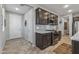 Kitchen with dark brown cabinets and stainless steel appliances at 13648 W Desert Glen Dr, Sun City West, AZ 85375