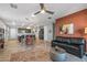Open living room features a comfortable couch, and access to a patio at 13648 W Desert Glen Dr, Sun City West, AZ 85375
