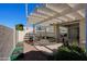 Covered patio with pergola and lush landscaping at 14790 W Merrell St, Goodyear, AZ 85395