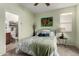 Bedroom with ensuite bathroom and ceiling fan at 16244 W Cheery Lynn Rd, Goodyear, AZ 85395