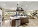 Kitchen boasts a large island, granite counters, and stainless steel appliances at 17115 S 178Th Ln, Goodyear, AZ 85338