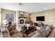 Living room with a fireplace and comfortable seating area at 17115 S 178Th Ln, Goodyear, AZ 85338