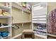 Large walk-in closet with shelving and drawers at 17115 S 178Th Ln, Goodyear, AZ 85338