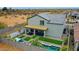 Aerial view of the home showcasing its pool, hot tub, patio, and stylishly designed backyard at 17706 W Villa Chula Ln, Surprise, AZ 85387
