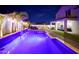 The backyard has a covered patio, outdoor seating, and a sparkling pool at 17706 W Villa Chula Ln, Surprise, AZ 85387