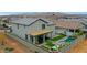 This backyard has a pool, spa, a desert-style backyard, and a dining area with mountain views at 17706 W Villa Chula Ln, Surprise, AZ 85387