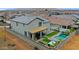 Aerial view of a home showcasing a backyard with a pool, spa, and outdoor dining area at 17706 W Villa Chula Ln, Surprise, AZ 85387