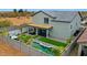 Aerial view of a spacious backyard featuring a pool, spa, patio, and desert landscaping at 17706 W Villa Chula Ln, Surprise, AZ 85387