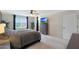 Bright bedroom with a large window, TV, and comfortable furnishings at 17706 W Villa Chula Ln, Surprise, AZ 85387