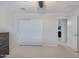 Bright bedroom with neutral walls, carpet, and closet with sliding doors at 17706 W Villa Chula Ln, Surprise, AZ 85387