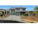 Picturesque two-story home with desert landscaping and a convenient three-car garage at 17706 W Villa Chula Ln, Surprise, AZ 85387