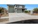 Charming two-story home with a three-car garage and low-maintenance desert landscaping at 17706 W Villa Chula Ln, Surprise, AZ 85387
