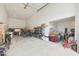This large garage features high ceilings, storage space, and room for work and hobbies at 17706 W Villa Chula Ln, Surprise, AZ 85387