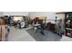Functional garage space equipped with a workbench, tools, and fitness gear at 17706 W Villa Chula Ln, Surprise, AZ 85387
