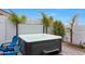 An inviting outdoor hot tub, perfect for relaxation, nestled in a private backyard setting with lush landscaping at 17706 W Villa Chula Ln, Surprise, AZ 85387