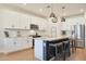 Spacious kitchen boasts granite counters, stainless appliances, and a large island with seating at 17706 W Villa Chula Ln, Surprise, AZ 85387