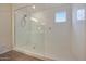 Contemporary shower with glass enclosure, white subway tile, and a window at 17706 W Villa Chula Ln, Surprise, AZ 85387