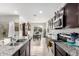 Modern kitchen featuring granite countertops and island at 17862 N Nocera Rd, Maricopa, AZ 85138