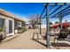 Charming backyard with a pergola, fire pit, comfortable seating, lush plants, and stone tile at 1815 N 74Th St, Scottsdale, AZ 85257