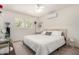 Bright bedroom with white walls, large window with shutters, and a comfortable queen-sized bed at 1815 N 74Th St, Scottsdale, AZ 85257
