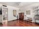 Bedroom featuring hardwood floors, vanity, storage, and a ceiling fan for comfortable living at 1815 N 74Th St, Scottsdale, AZ 85257