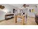 Bright dining room features a large table with seating for eight and a charming mix of decor and artwork at 1815 N 74Th St, Scottsdale, AZ 85257