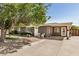 Inviting front exterior showcasing a well-lit entrance, complemented by a spacious driveway at 1815 N 74Th St, Scottsdale, AZ 85257