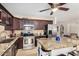Spacious kitchen with stainless steel appliances, a center island, and dark wood cabinets at 1815 N 74Th St, Scottsdale, AZ 85257