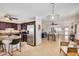 Open-concept kitchen and dining area with ample counter space, modern appliances, and bright natural light at 1815 N 74Th St, Scottsdale, AZ 85257