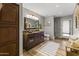 Bathroom with wooden vanity and a walk-in shower at 1848 E Mallory St, Mesa, AZ 85203