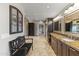 Elegant bathroom with long vanity, bench, and ample storage at 1848 E Mallory St, Mesa, AZ 85203