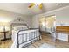 Cozy bedroom with metal bed frame and mirrored closet at 1848 E Mallory St, Mesa, AZ 85203