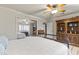 Bright bedroom with wood floors, built-in shelving and large mirror at 1848 E Mallory St, Mesa, AZ 85203