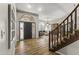 Bright entryway with hardwood floors and a view of the staircase at 1848 E Mallory St, Mesa, AZ 85203