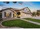 Two-story house with a landscaped yard, double garage, and walkway at 1848 E Mallory St, Mesa, AZ 85203