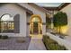 Front entry of two-story home with a landscaped walkway at 1848 E Mallory St, Mesa, AZ 85203