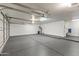 Spacious garage with epoxy floor and ample storage at 1848 E Mallory St, Mesa, AZ 85203