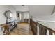 Spacious hallway with hardwood floors and a rustic wooden table at 1848 E Mallory St, Mesa, AZ 85203