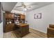 Home office with built-in wooden desk and shelving at 1848 E Mallory St, Mesa, AZ 85203