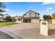 Two-story home with a three-car garage and manicured lawn at 1848 E Mallory St, Mesa, AZ 85203