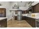 Modern kitchen with stainless steel appliances and marble countertops at 1848 E Mallory St, Mesa, AZ 85203