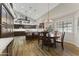 Eat-in kitchen with an island, hardwood floors, and dark wood cabinets at 1848 E Mallory St, Mesa, AZ 85203
